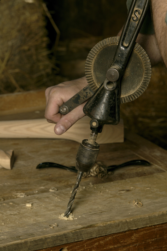 amish man using a drill